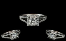 Platinum - Superb Split-Set Diamond Set Dress Ring. The Central Princes Cut Diamond Surrounded by