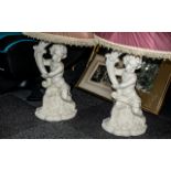 A Pair of Figural Painted Plaster Figures Depicting Putti Holding Cornucopia Lamps both with silk