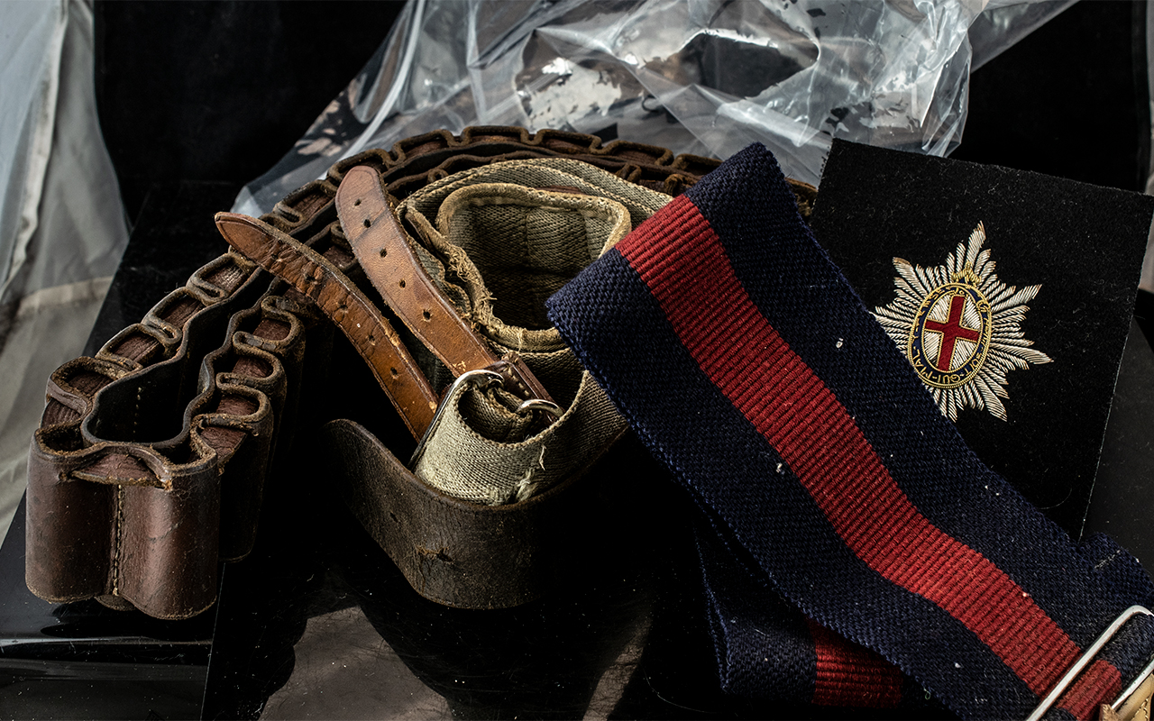 Military Interest - Cartridge Belt together with two webbing belts and insignia.