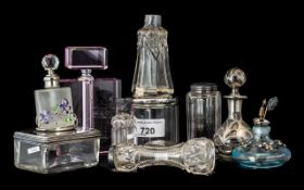 Collection of Glass Perfume Bottles, some with silver tops, eight in total,