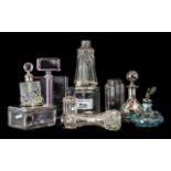 Collection of Glass Perfume Bottles, some with silver tops, eight in total,