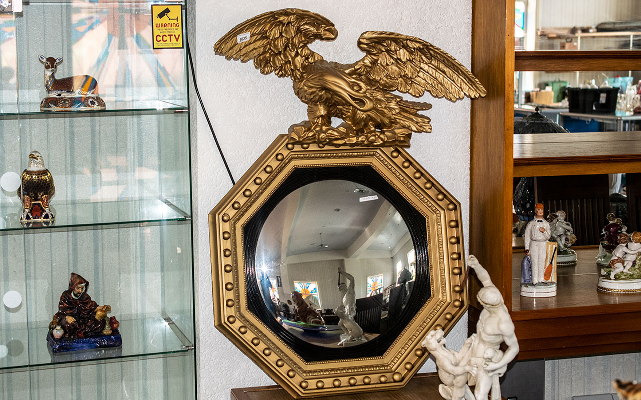 Regency Style Convex Consul Mirror, with carved eagle pediment.