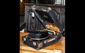 A Decce 85 Portable Record Player Crank Driven together with a collection of records.