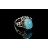 Larimar and Sapphire Ring, an oval cut cabochon of over 6cts of larimar,