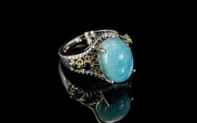 Larimar and Sapphire Ring, an oval cut cabochon of over 6cts of larimar,
