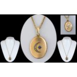 Antique Period - Pleasing 9ct Gold Crescent Moon and Sun Design Oval Shaped Hinged Locket.