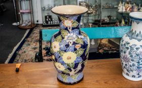 Large Decorative Vase in shades of blue and yellow, marks to base, measures 20" tall.