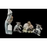 Four Lladro Figures, comprising two figures of cats with mice No. 4703, Rabbit figure No. 4772,