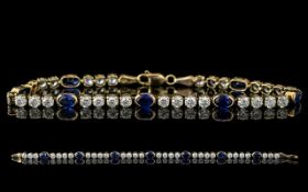 Ladies - 14ct Gold Attractive Sapphire and Diamond Set Line Bracelet. Full Hallmark for 585 -