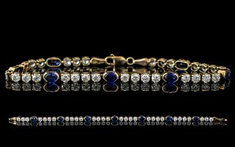 Ladies - 14ct Gold Attractive Sapphire and Diamond Set Line Bracelet. Full Hallmark for 585 - 14ct.