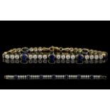 Ladies - 14ct Gold Attractive Sapphire and Diamond Set Line Bracelet. Full Hallmark for 585 - 14ct.