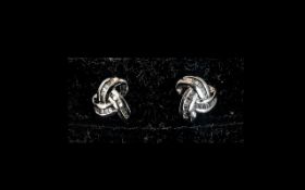 Diamond Triple Knot Stud Earrings, comprising baguette cut diamonds totalling .