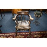 Oak Windsor Captain's Chair, bobbin turned. Traditional style, saddle seat, turned stretchers.