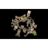A Vintage Good Quality Sterling Silver Charm Bracelet - Loaded with Over 21 Good Silver Charms.