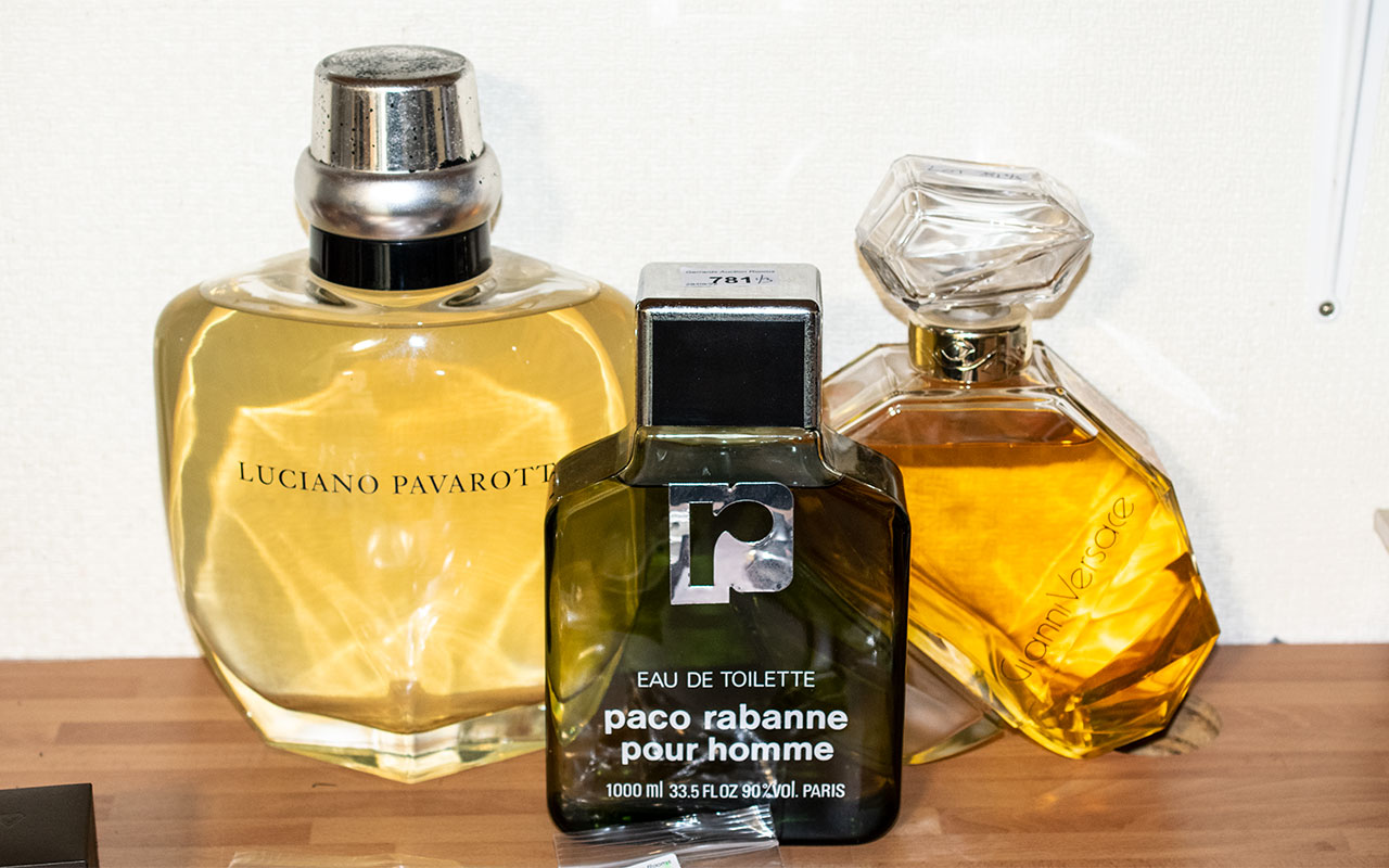 Three Shop Display Perfume Bottles Advertising Gianni Versace, Luciano Pavarotti And Paco Robanne.