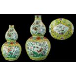 An Antique Chinese Double Gourd Vase painted floral enamel decoration with birds, butterflies etc.