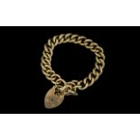 A Superb 9ct Gold Solid Curb Bracelet with 9ct Gold Heart Shaped Padlock and Safety Chain.