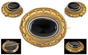 Victorian Period 9ct Gold - Black Sardonyx Mourning Brooch of Oval Form with Safety Chain. c.1860's.