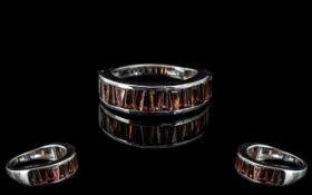 Garnet Half Eternity Ring, size R; baguette cut garnets, totalling 3cts, channel set,