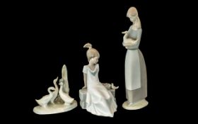 Three Nao Figures, comprising a 11" tall figure of a girl with a duck, three geese,