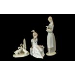 Three Nao Figures, comprising a 11" tall figure of a girl with a duck, three geese,