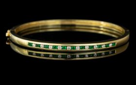 18ct Gold - Good Quality and Attractive Emerald and Diamond Set Hinged Bangle of Pleasing Design /