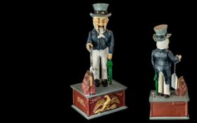 Cast Iron Uncle Sam Money Box, measures 11" tall.