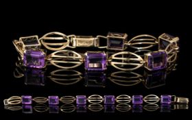 A Well Designed 9ct Gold Amethyst Set Bracelet. Full Hallmark for 9.375.