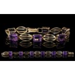 A Well Designed 9ct Gold Amethyst Set Bracelet. Full Hallmark for 9.375.