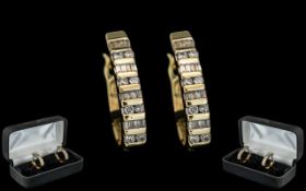 14ct Gold - Attractive Ladies Pair of Baguette and Brilliant Cut Diamond Hoop Earrings. Marked 14ct.