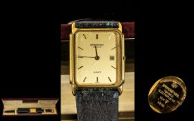 Raymond Weil Gentleman's Quartz Watch, gold tone face with baton numerals and date aperture.