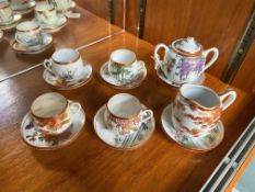 A Part Japanese Teaset comprising milk jug, two handled sugar bowl and 6 cups and 6 saucers.