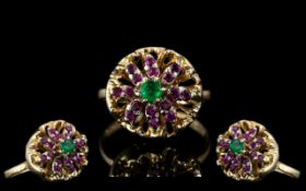 Ladies Attractive 14ct Gold Ruby and Emerald Set Cluster Ring. The Central Emerald Surrounded by a