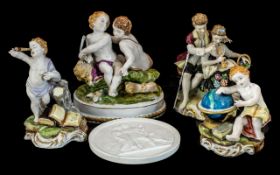 Collection of Four Spanish Figural Pieces, comprising a cherub with a globe 5'' tall, a courting