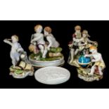 Collection of Four Spanish Figural Pieces, comprising a cherub with a globe 5'' tall, a courting