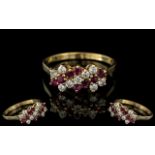 18ct Gold Attractive Diamond & Ruby Set Dress Ring, marked 750 to interior of shank.