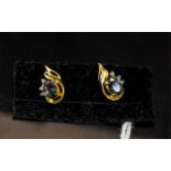 Mystic Topaz and Diamond Stud Earrings, each oval cut topaz displaying flashes of royal purple and