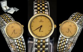 Omega - Deville Ladies 18ct Gold and Steel Quartz Bracelet Watch, With Champagne Dial.