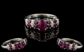 Ladies 9ct White Gold - Attractive Ruby and Diamond Set Ring. Full Hallmark for 9.375.
