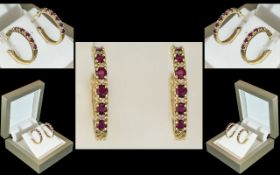 Ladies Attractive / Impressive 14ct Gold Rubies and Diamond Hoop Earrings. Marked 14ct.