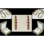 Ladies Attractive / Impressive 14ct Gold Rubies and Diamond Hoop Earrings. Marked 14ct.