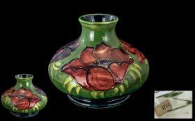 Moorcroft - Hand Painted Tube lined Onion Shaped Vase. Signed William Moorcroft to Base.