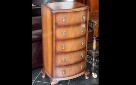 Small Chest of Five Drawers, with decorative pull handles. Raised on four ball feet.