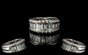 18ct White Gold - Attractive Diamond Set Half Eternity Ring. Marked 750 -18ct. The Step-cut Diamonds