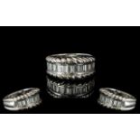 18ct White Gold - Attractive Diamond Set Half Eternity Ring. Marked 750 -18ct. The Step-cut Diamonds