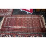 Wool Rug Aztec Design, pink and red with fringing, measures 93 cm x 168 cm. In good condition.