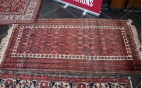 Wool Rug Aztec Design, pink and red with fringing, measures 93 cm x 168 cm. In good condition.