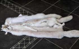 Three Arctic Fox Pelts, Excellent condition. Each measuring approx 136 cms in length.