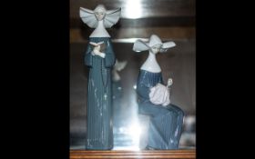 Two Lladro Nun Figures comprising Prayerful Moment and Time to Sew. Measuring 11 and 9 inches.