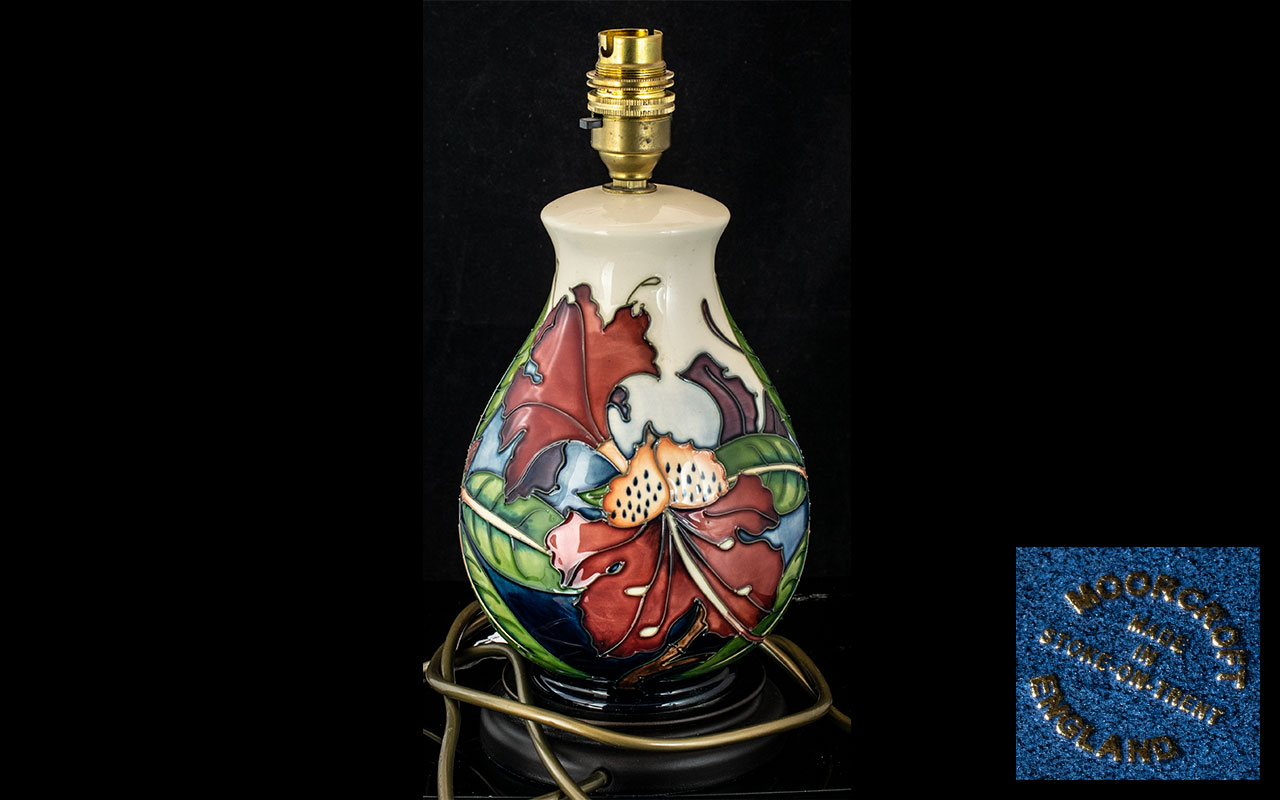 Moorcroft Lamp Base, Orchid & Spring Flowers, measures approx 11" tall.